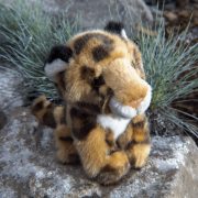 Amur Leopard cuddly toy with background