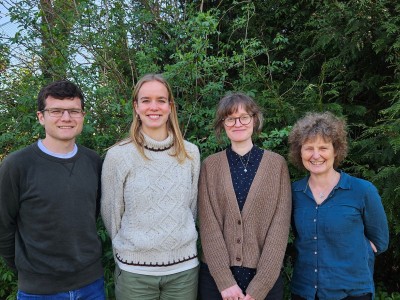 Four smiling people from the Positive Team at Oxford university