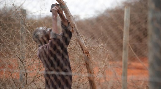 Local man setting up a lion light - designed to scare away predators from livestock areas.