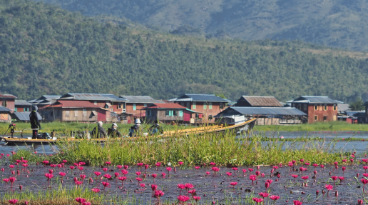a group of people travelling via boat to Lake Inle